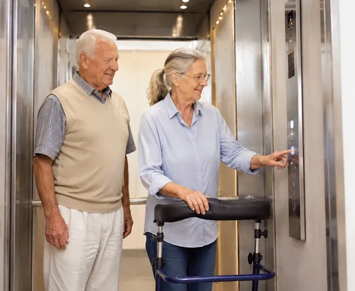 Elderly couple using an elevator